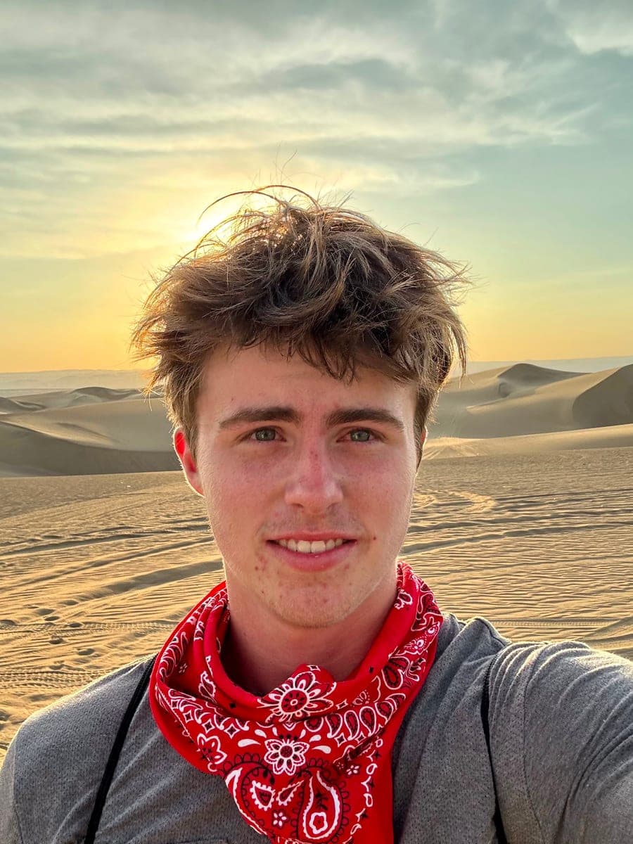 River Tompkins on the sand dunes outside Ica, Peru at sunset
